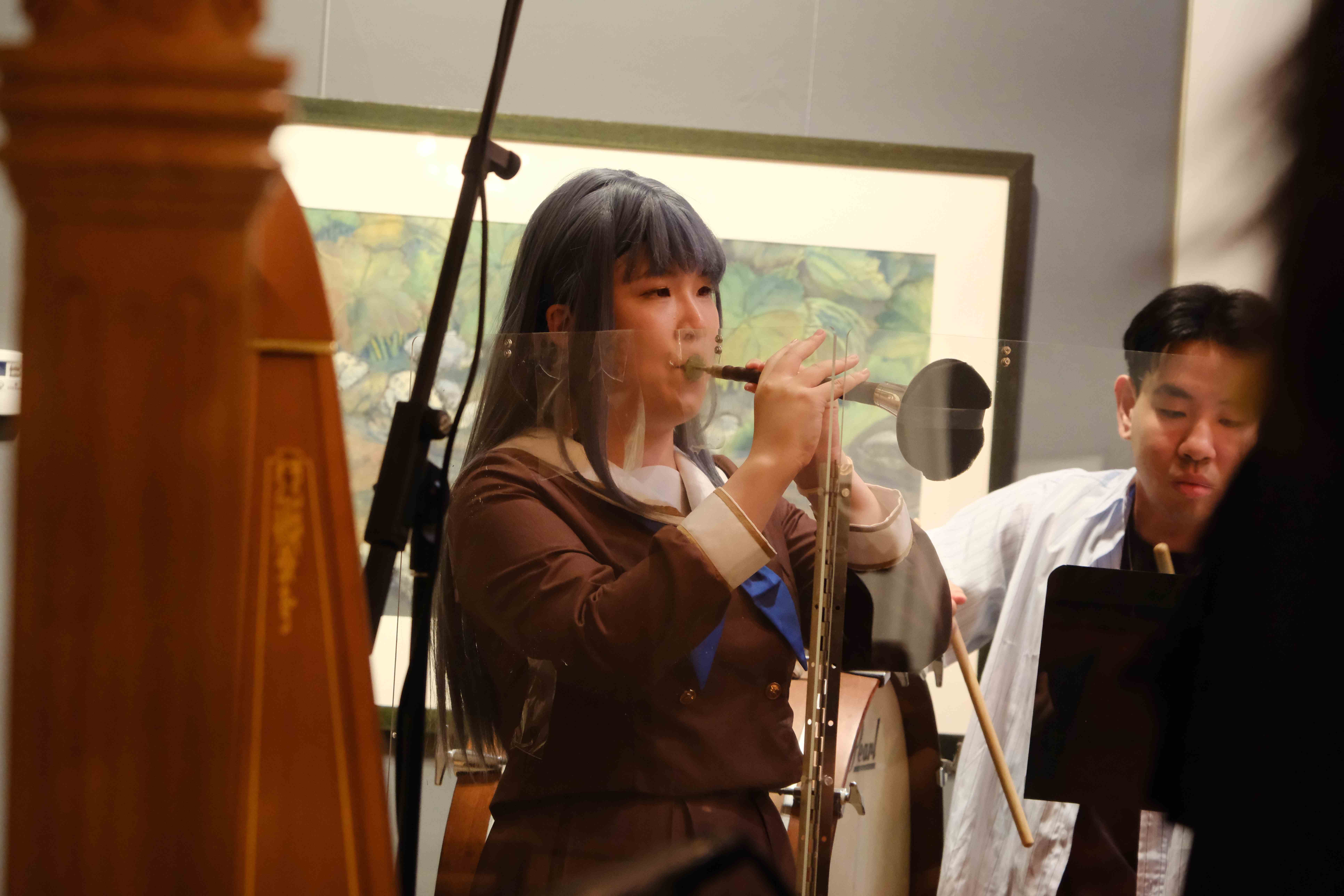 Suona player performing traditional Chinese wind instrument