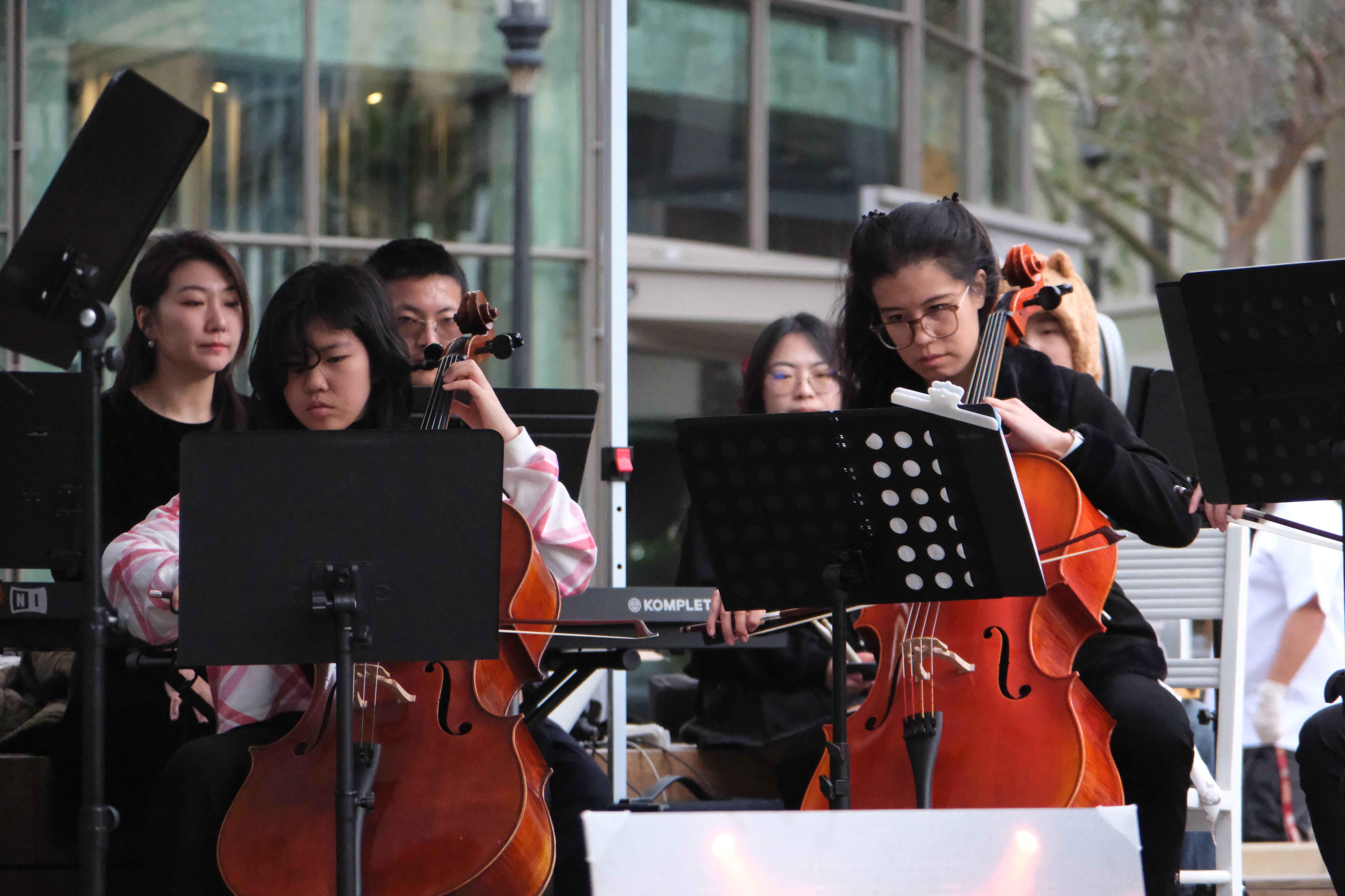 Cellists performing at the GG x Smitten Ice Cream event at Santana Row